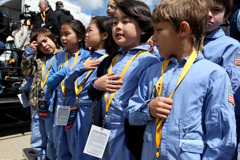 Students watch the shuttle Enterprise arrive at JFK